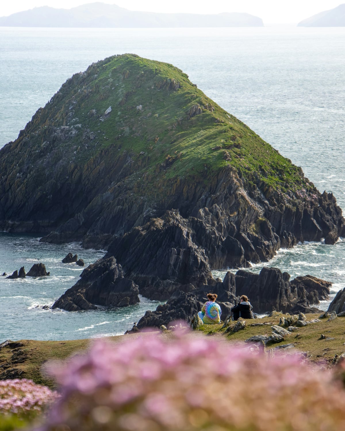 Friends looking out over the coast in Dingle, Ireland